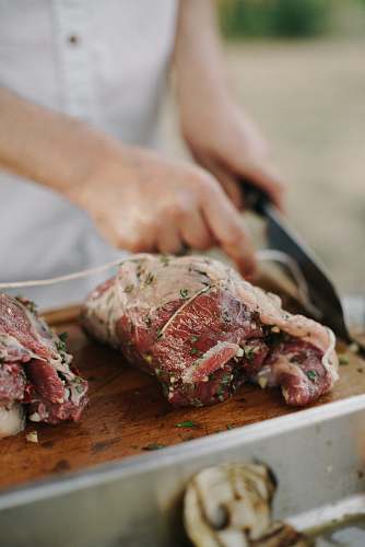 bbq meats on brown chopping baord meat