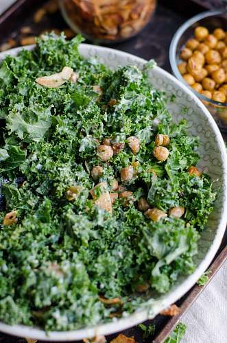 kale nuts and parsley in a bowl produce