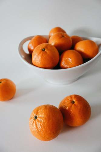 fruit orange fruits on white bowl plant