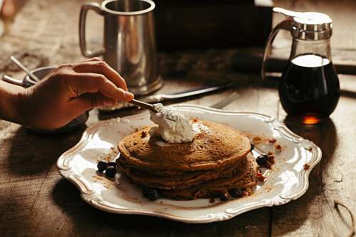 cream pancake with butter on white ceramic plate dessert