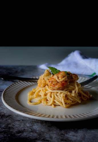 pasta pasta dish on white ceramic plate spaghetti