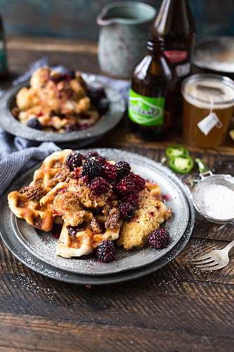 bottle pasta on grey plate berries