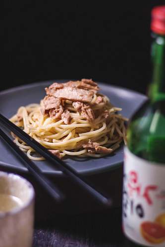 cream pasta with meat on plate creme