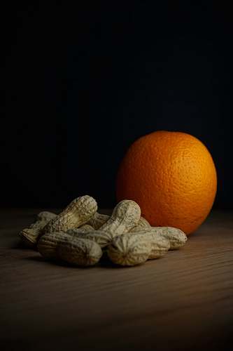 plant peanuts and orange fruit photograph orange