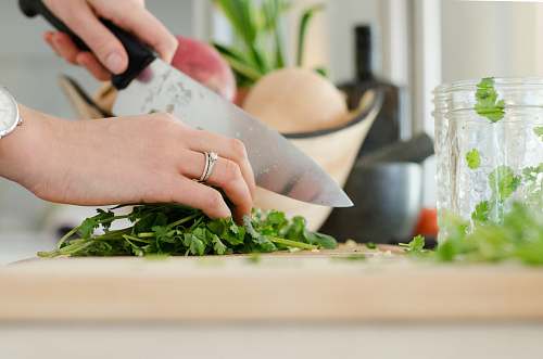 cooking person cutting vegetables with knife kitchen