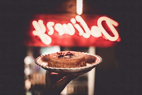 dessert person holding cake in bowl cake