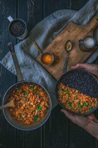 meal person holding pot with cook food curry