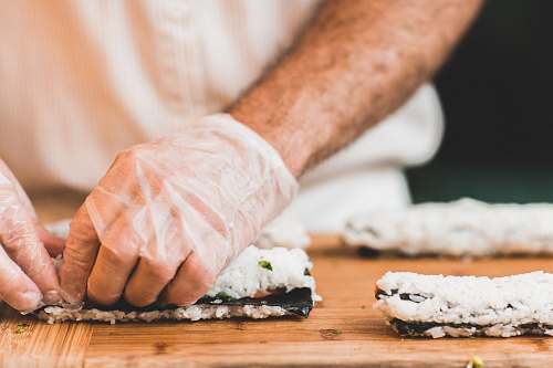 sushi person making sushi sushi roll