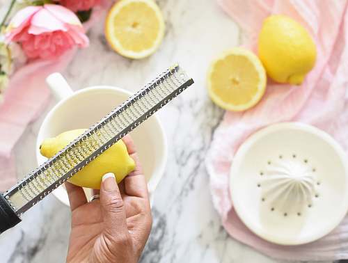 plant person slicing lemon citrus fruit