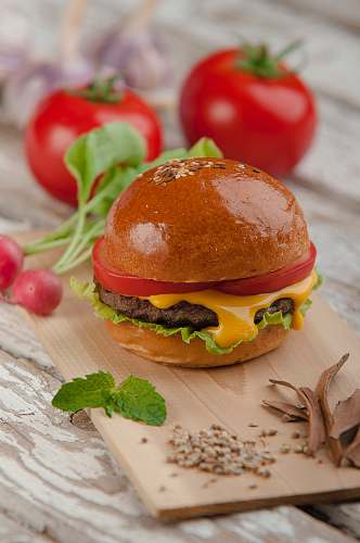 burger photo of burger with tomato and cheese jar