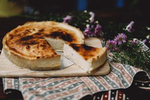 flora pie with one slice cut off on brown wooden tray jar