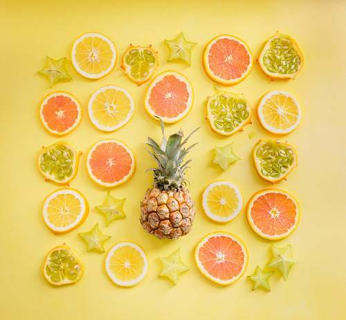 fruit pineapple surrounded by citrus fruits pineapple