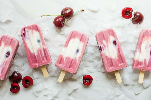 fruit pink Popsicle with cherries on ice cherry