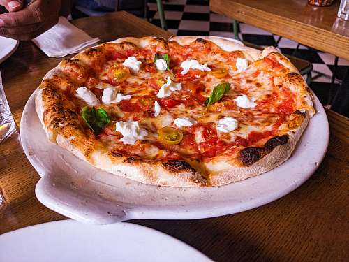 pizza pizza with cheese and pepperoni dining table