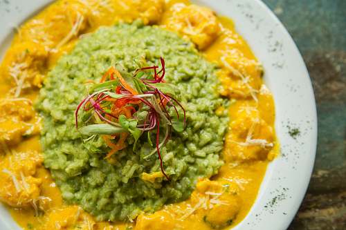 flora plate of green and yellow sauce curry