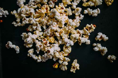 popcorn popcorn on black panel snack