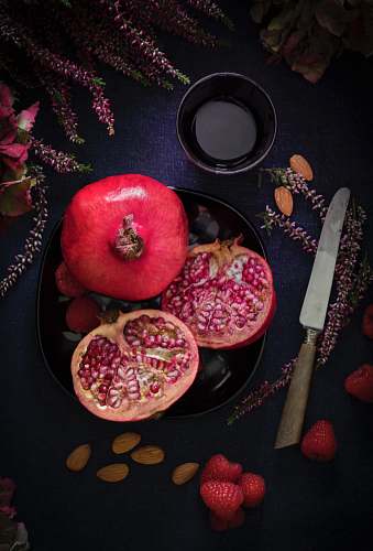 fruit red fruit on black plate flora