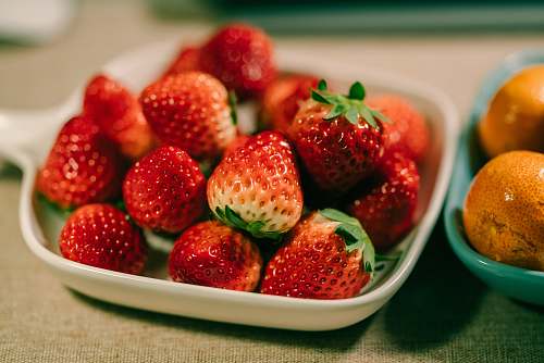 plant red strawberries on saucer fruit
