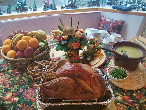 dinner roasted chicken beside basket of fruits supper