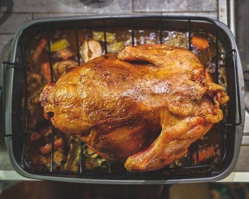 bbq roasted chicken on top of grill brown