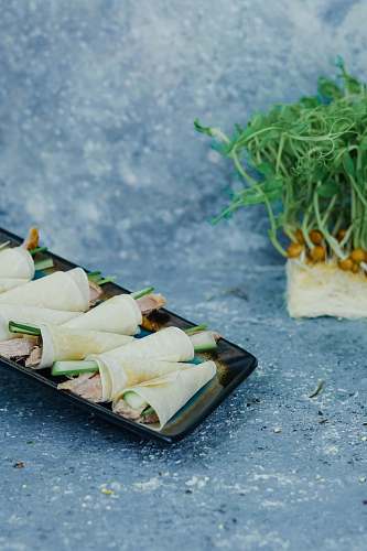 dish rolled sprout vegetable with ham on tray meal