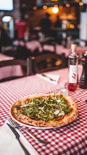pizza round pizza with vegetable cutlery