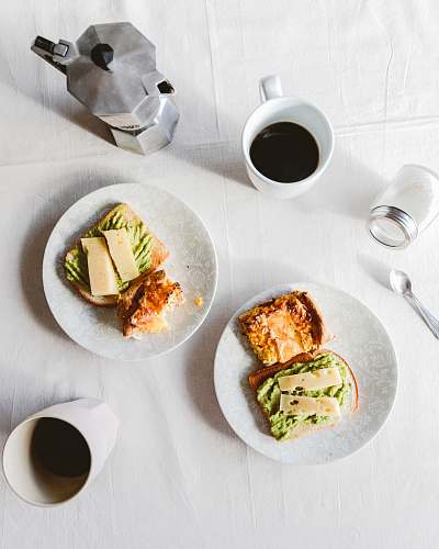 breakfast sandwich on white ceramic plate meal