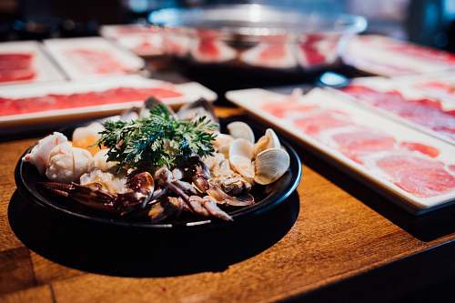 meal seafood dish on black plate dish