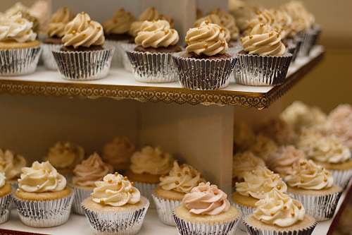 cupcake selective focus photo of 2-tiered cupcakes dessert