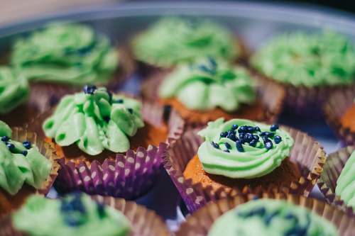 cake selective focus photo of muffins icing