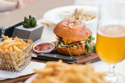burger selective focus photography of burger and fries beer