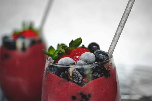 fruit selective focus photography of glass of strawberry drink plant