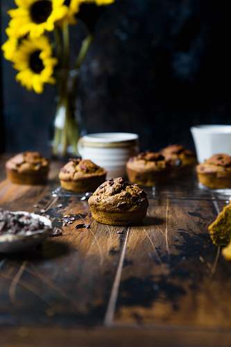 cup selective focus photography of muffin on top of table cake