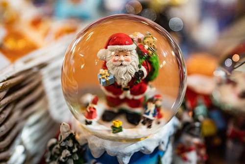 confectionery selective focus photography of Santa Claus snowglove sweets