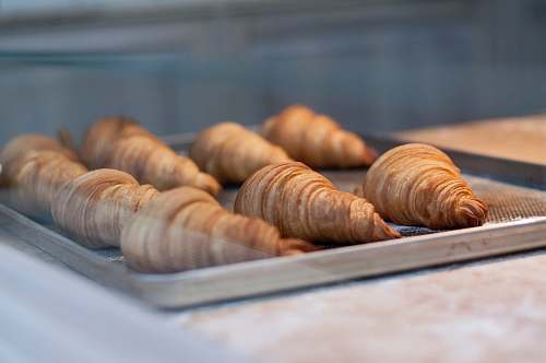 croissant seven croissant on gray metal tray bread