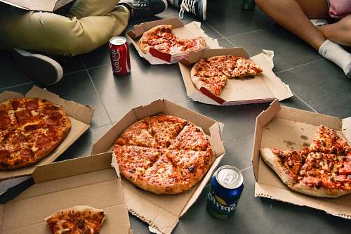 pizza several sliced pizzas coke