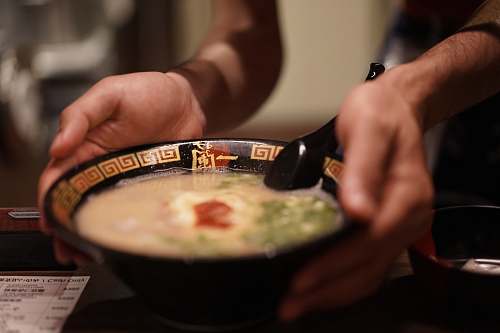 bowl shallow focus photo of soup in black ceramic bowl dish