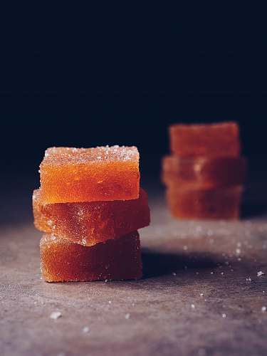 sweets six brown cubes on gray surface confectionery