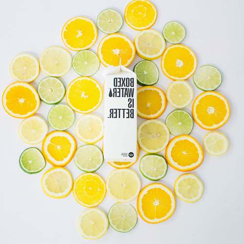 plant Sliced citrus fruits and a Boxed Water carton citrus fruit