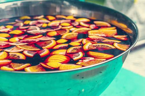 meal sliced orange fruits on body of water dish