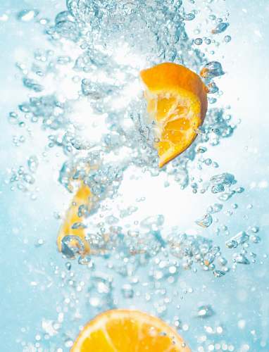 fruit sliced orange fruits underwater drink