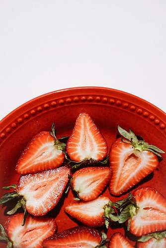 plant sliced strawberries on bowl strawberry