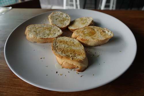 bread slices of toasted bread on white plate dish