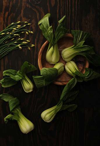 vegetable spinaches on brown wooden plate human