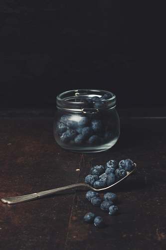 fruit spoonful of blueberries from glass jar blueberry