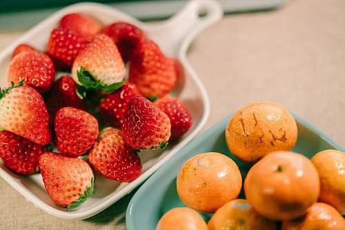 plant strawberries and olives on saucers fruit
