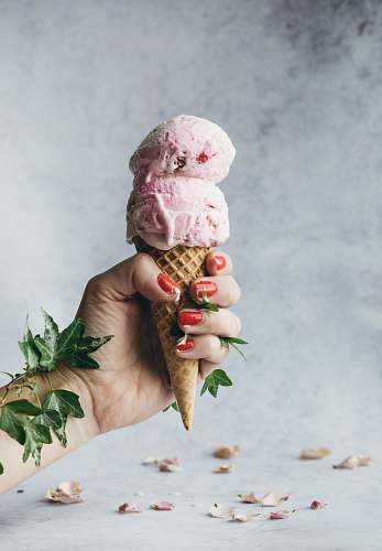 dessert strawberry ice cream on a cone creme