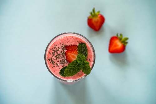 fruit strawberry juice on white surface drink