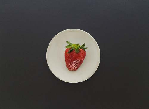 fruit strawberry on white saucer plant