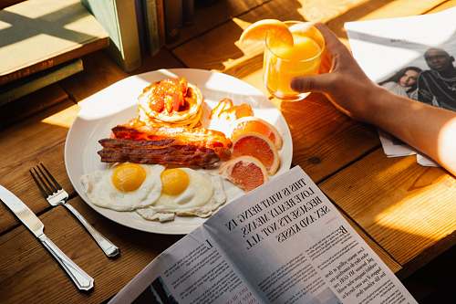 breakfast sunny-side up served on plate human